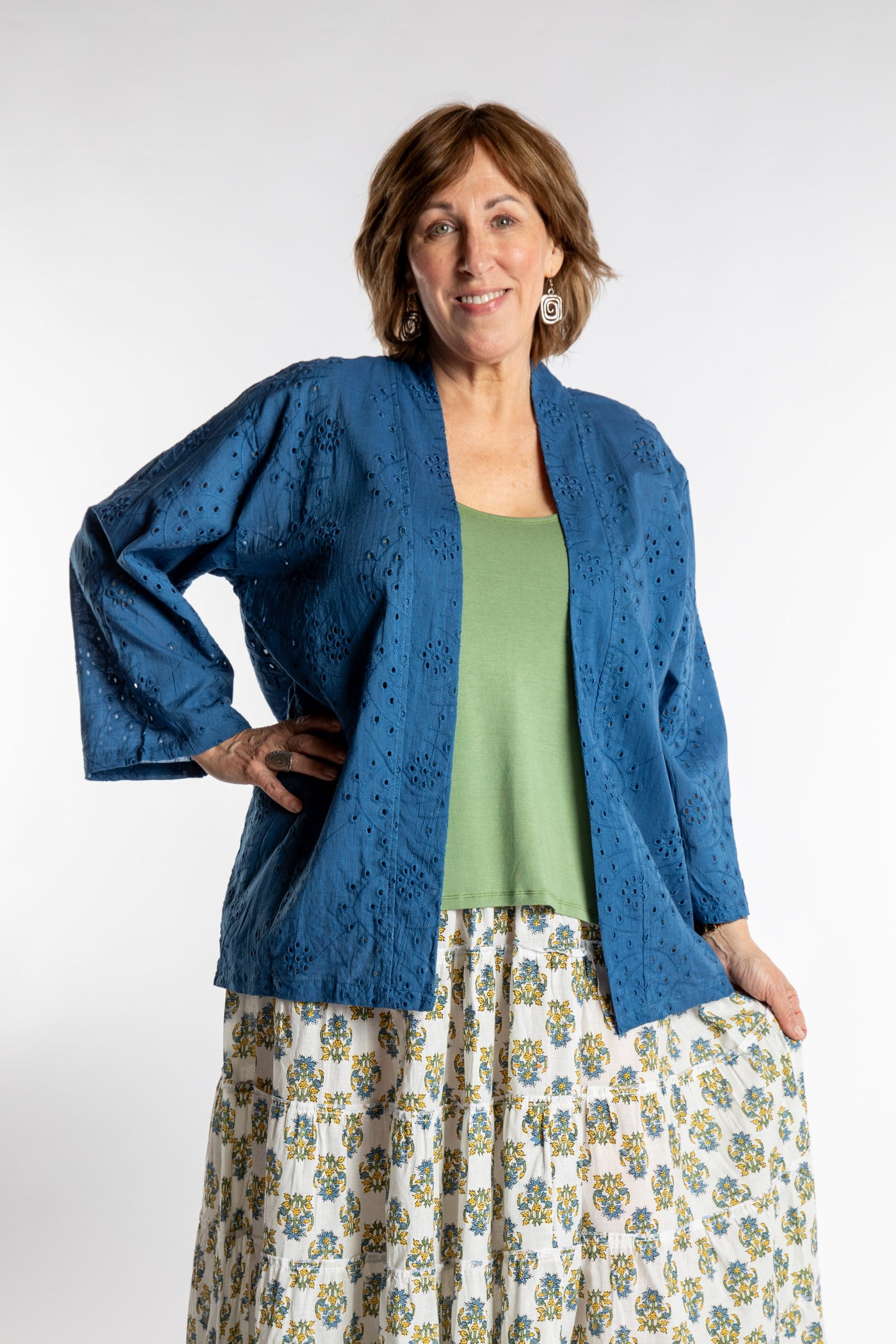 Betty is wearing the one size Anandi cardigan in Blue