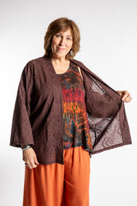 Betty is wearing the one size Anandi cardigan in Brown
