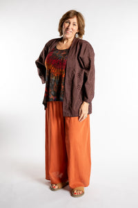 Betty is wearing the one size Anandi cardigan in Brown