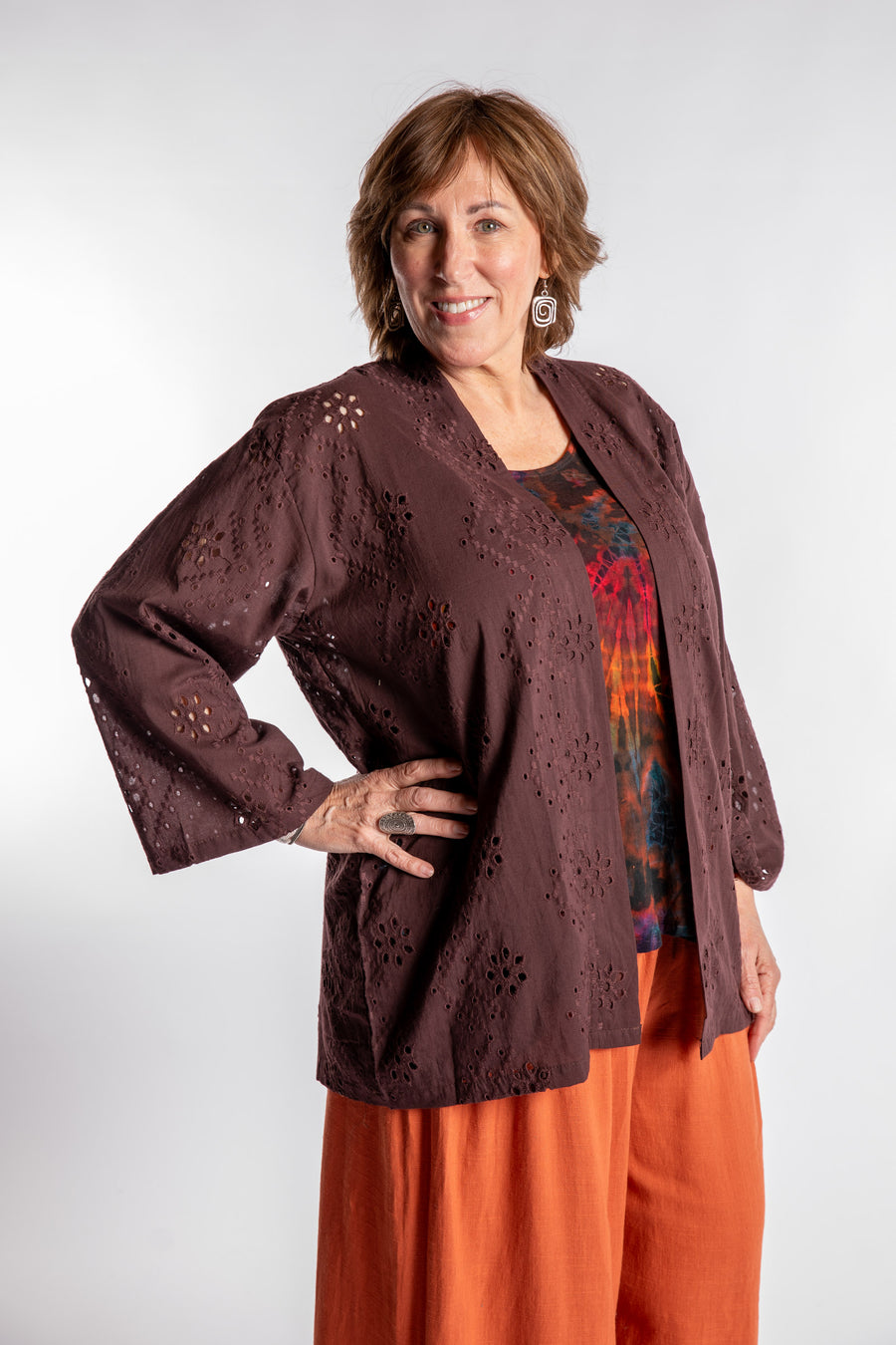 Betty is wearing the one size Anandi cardigan in Brown