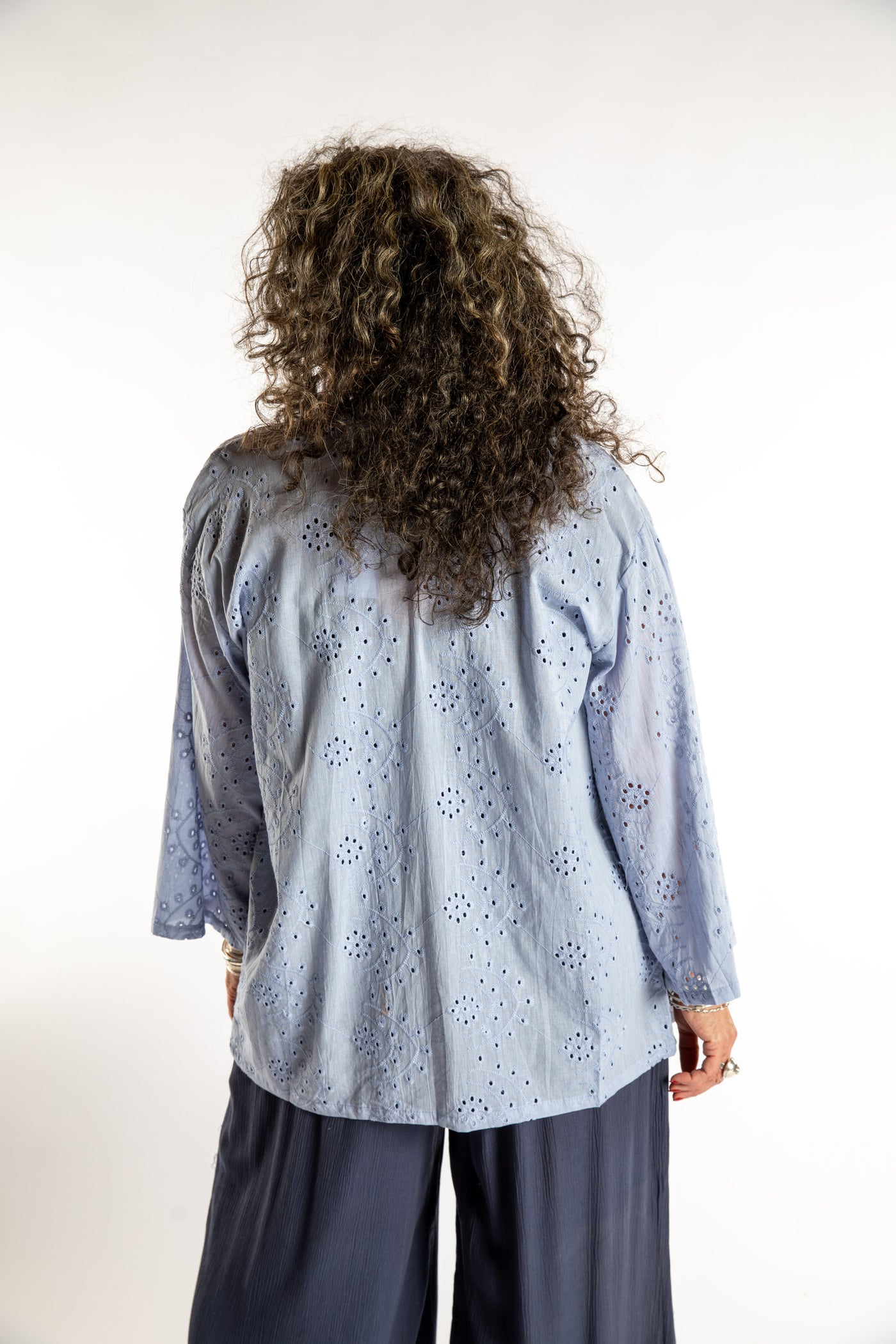 Susan is wearing the one size Anandi cardigan in Periwinkle