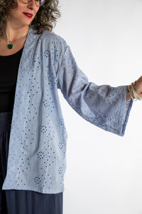 Susan is wearing the one size Anandi cardigan in Periwinkle