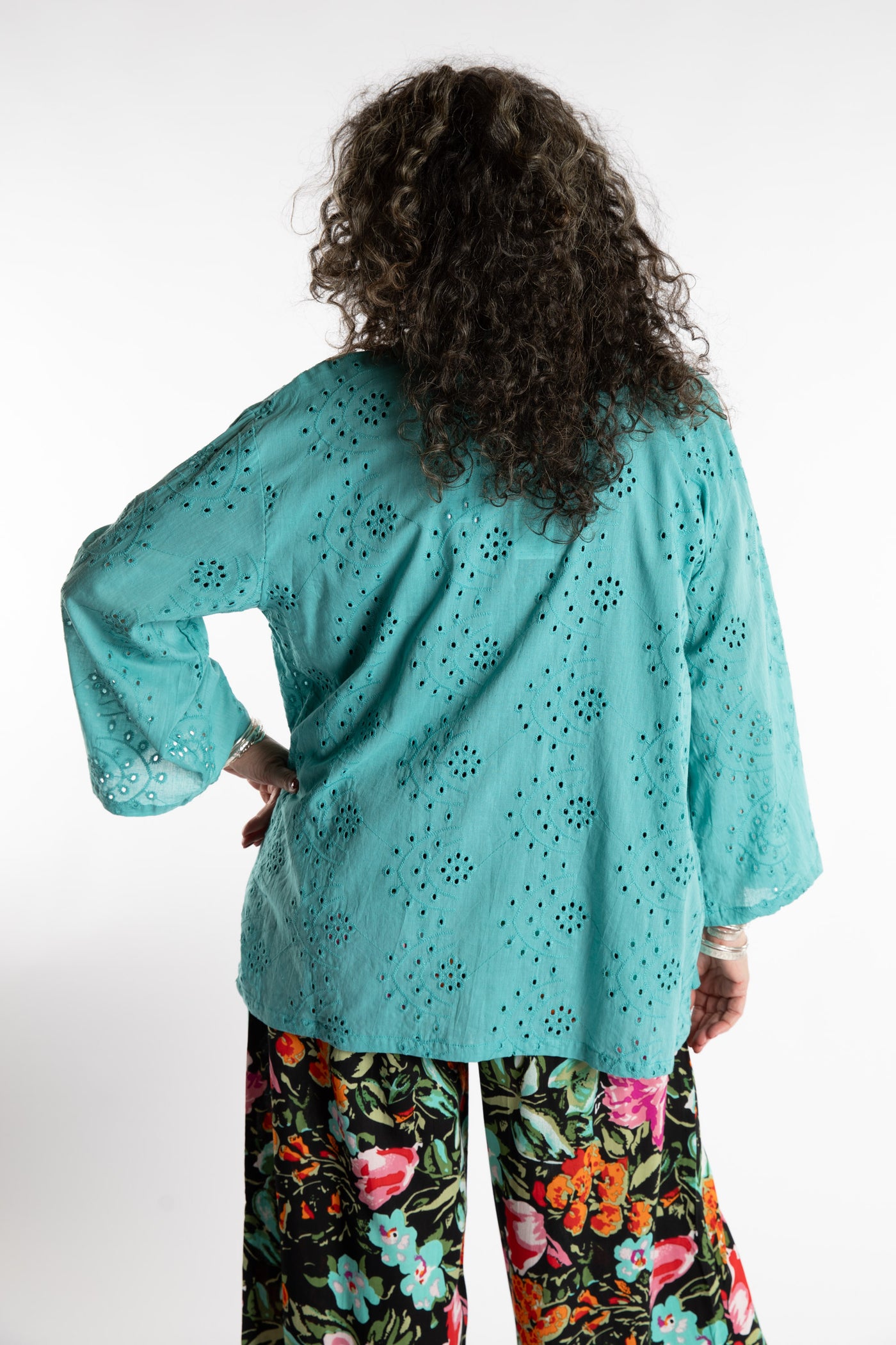 Susan is wearing the one size Anandi cardigan in Seafoam