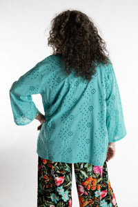 Susan is wearing the one size Anandi cardigan in Seafoam