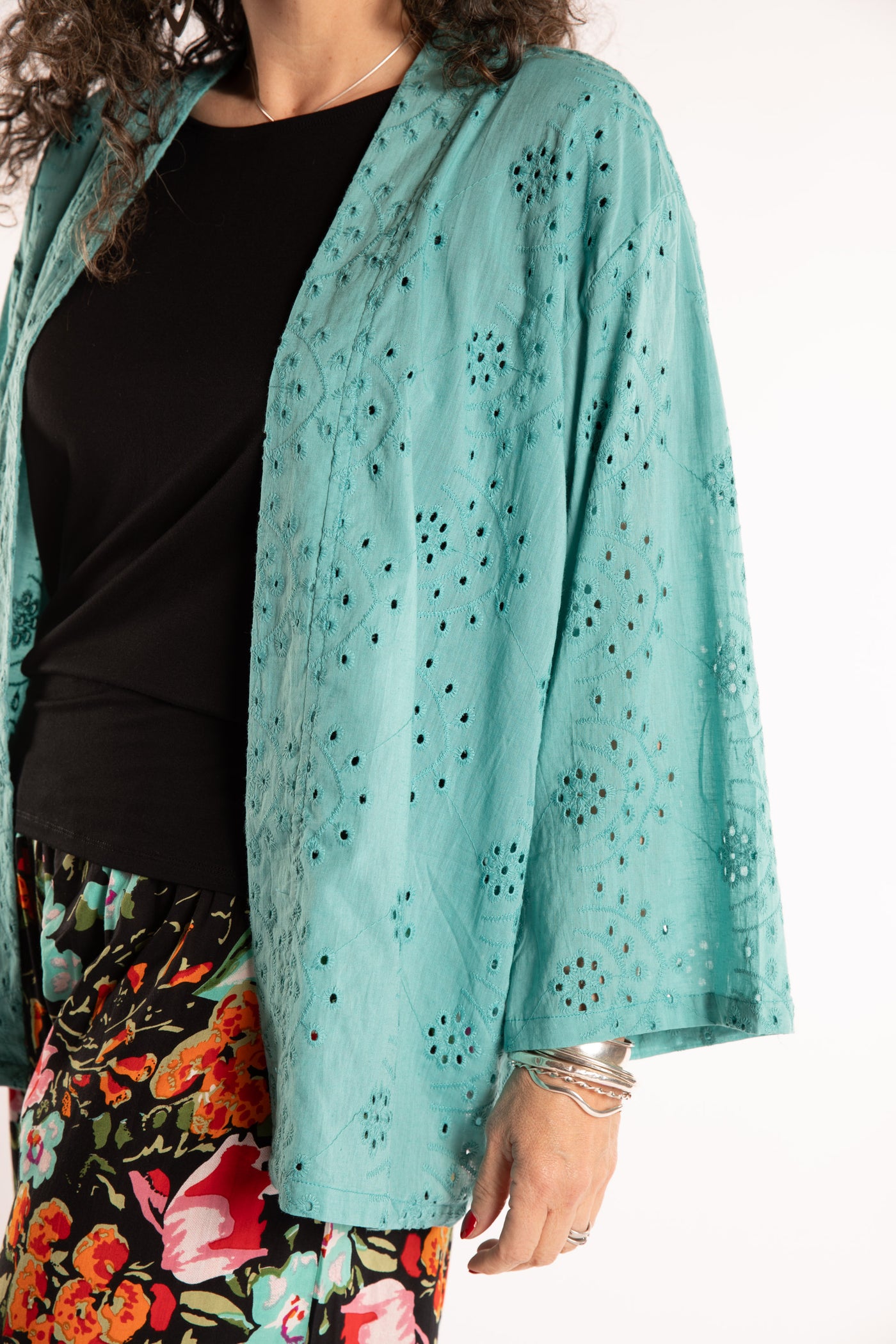 Susan is wearing the one size Anandi cardigan in Seafoam