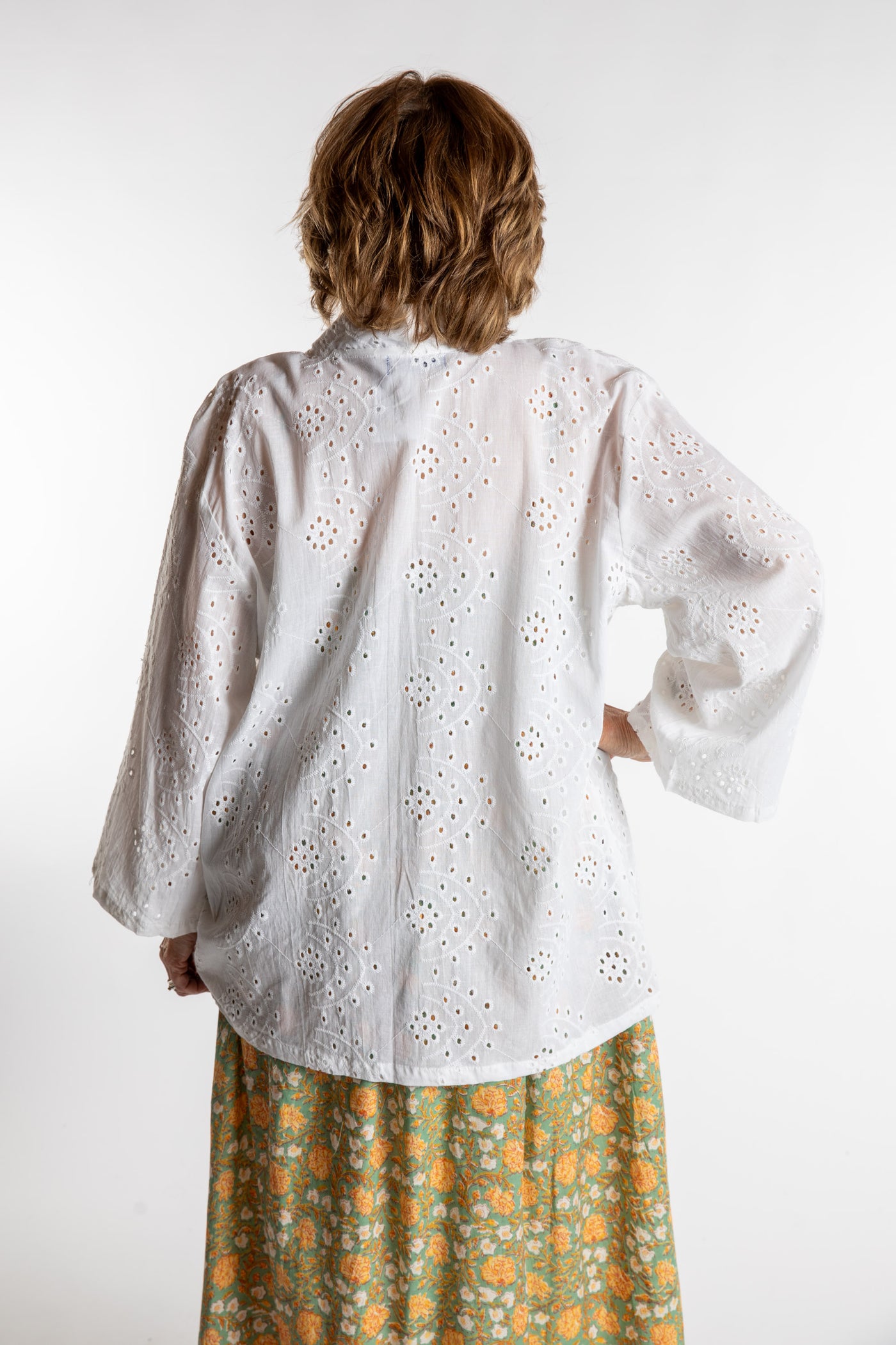 Betty is wearing the one size Anandi cardigan in White