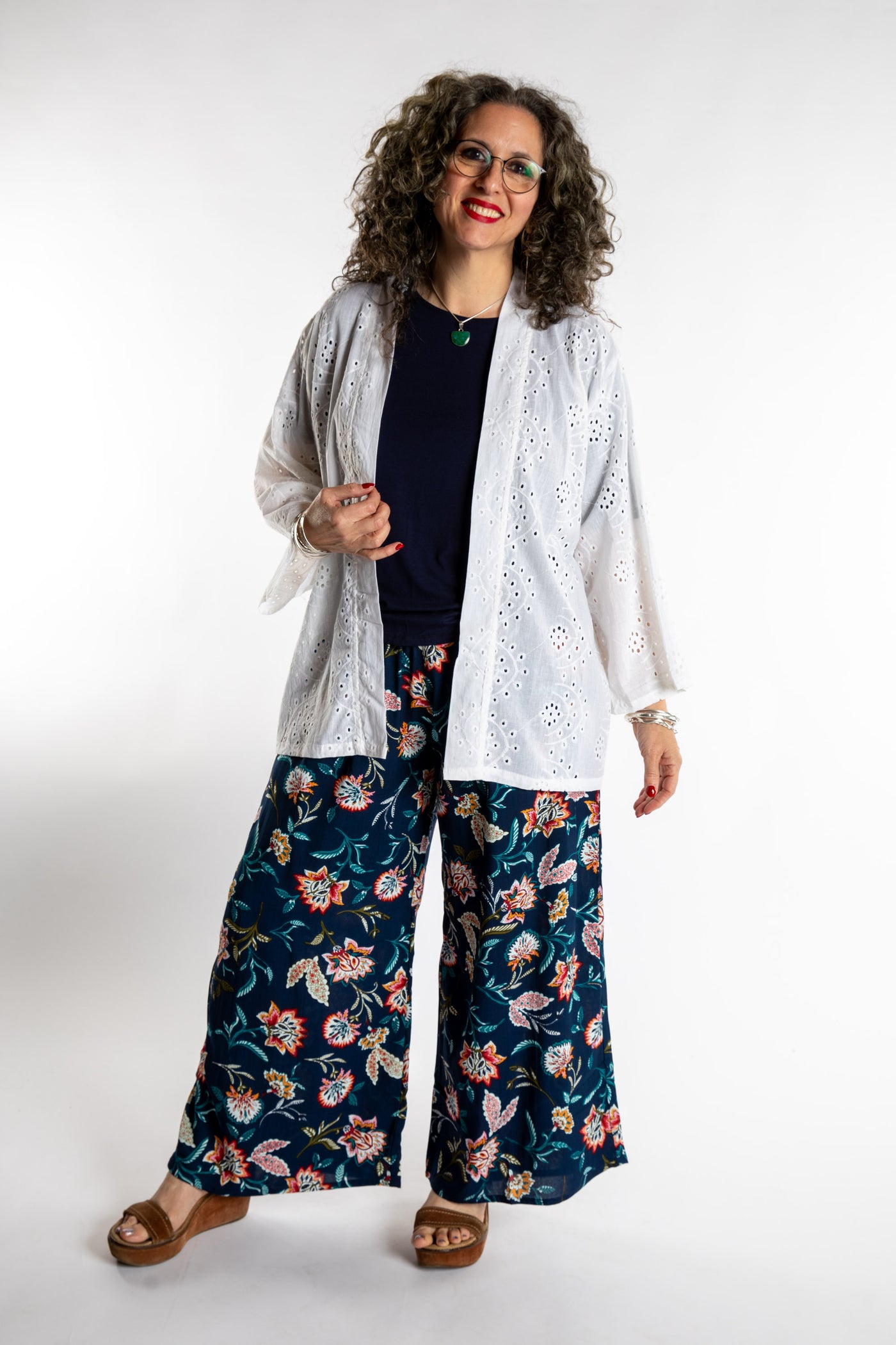 Susan is wearing the one size Anandi cardigan in White
