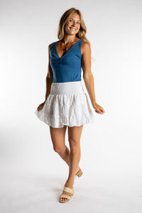 Sophie is wearing the one size Anandi Mini Skirt in White