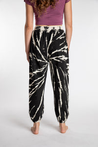 Emily is wearing the Black Anika Tie Dye Jogger Pants in S/M