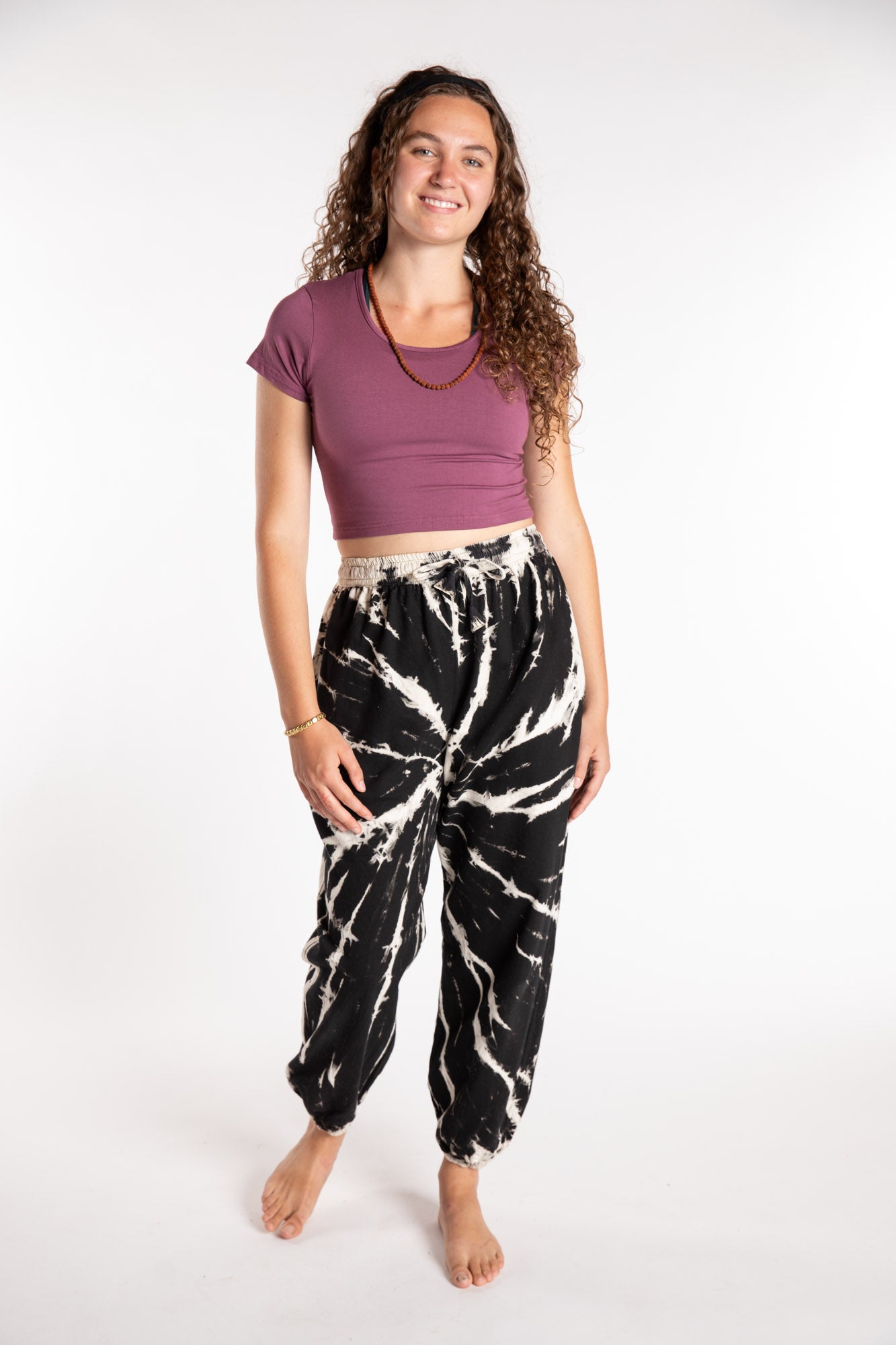 Emily is wearing the Black Anika Tie Dye Jogger Pants in S/M