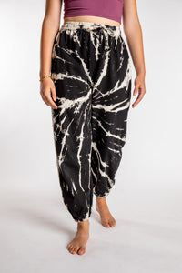Emily is wearing the Black Anika Tie Dye Jogger Pants in S/M