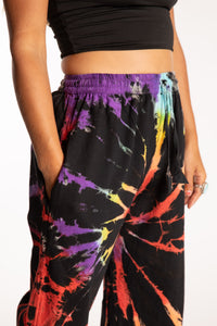 Sophie is wearing the Rainbow Anika Tie Dye Jogger Pants in S/M