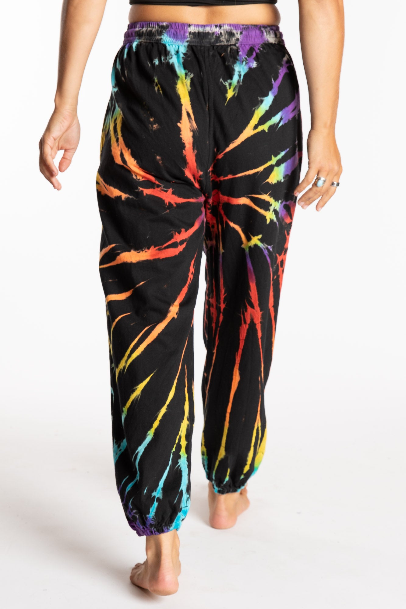 Sophie is wearing the Rainbow Anika Tie Dye Jogger Pants in S/M