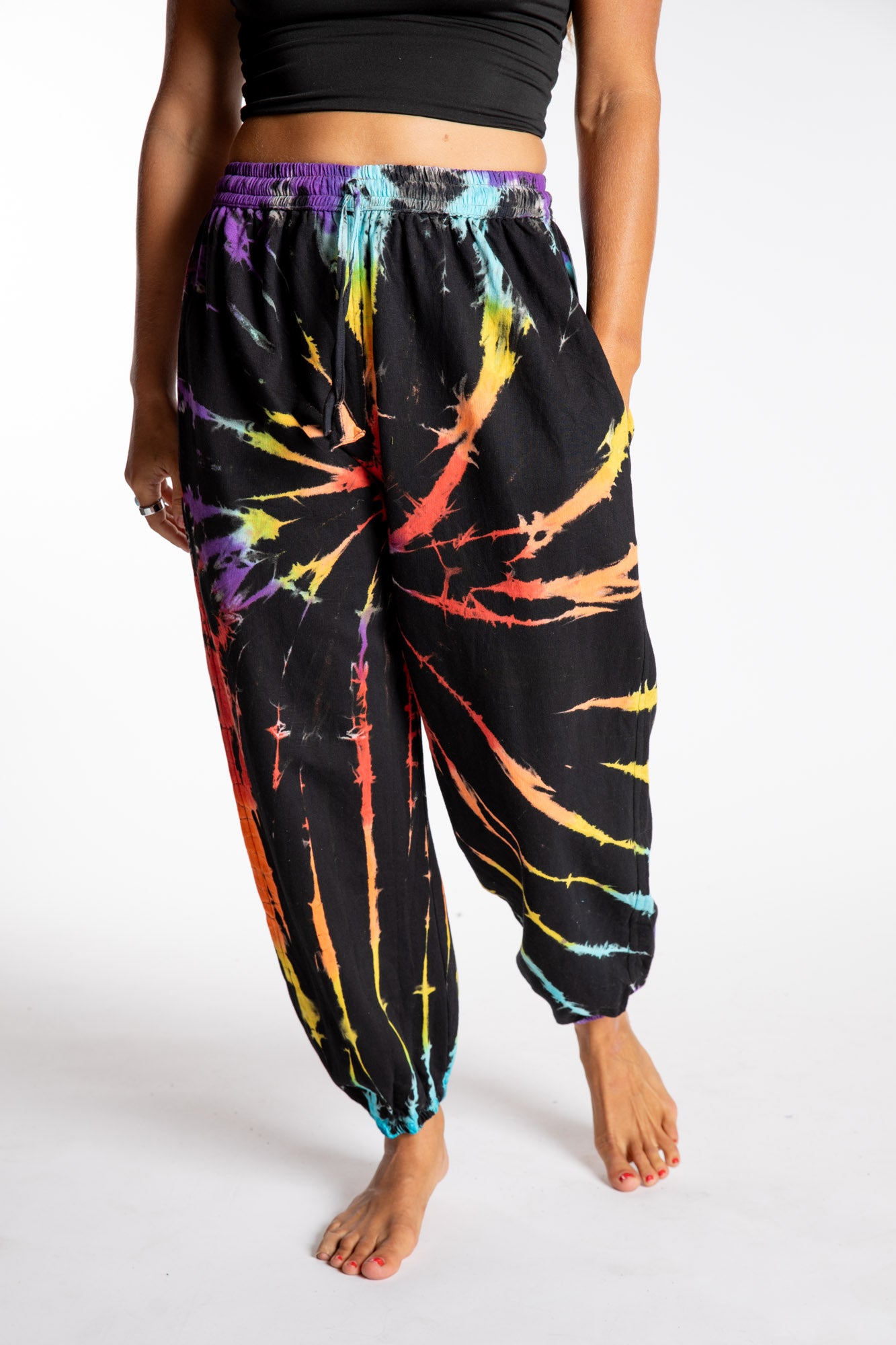Sophie is wearing the Rainbow Anika Tie Dye Jogger Pants in S/M