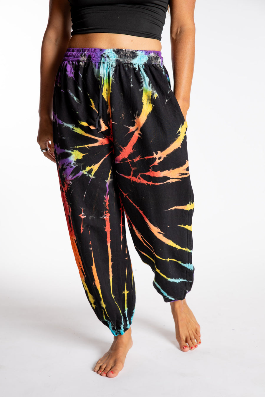 Sophie is wearing the Rainbow Anika Tie Dye Jogger Pants in S/M