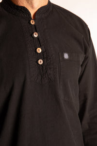 Topher is wearing the Large Arun Band Collar Cotton Shirt in Black