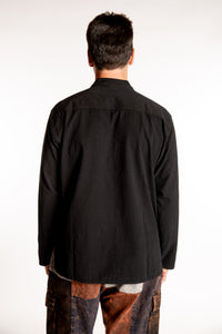 Topher is wearing the Large Arun Band Collar Cotton Shirt in Black