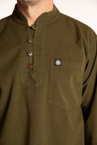 Topher is wearing the Large Arun Band Collar Cotton Shirt in Olive