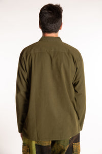 Topher is wearing the Large Arun Band Collar Cotton Shirt in Olive