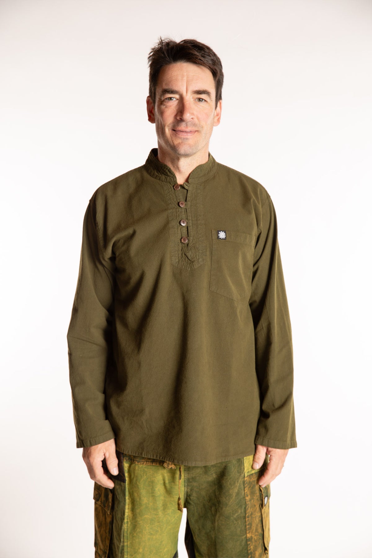 Topher is wearing the Large Arun Band Collar Cotton Shirt in Olive