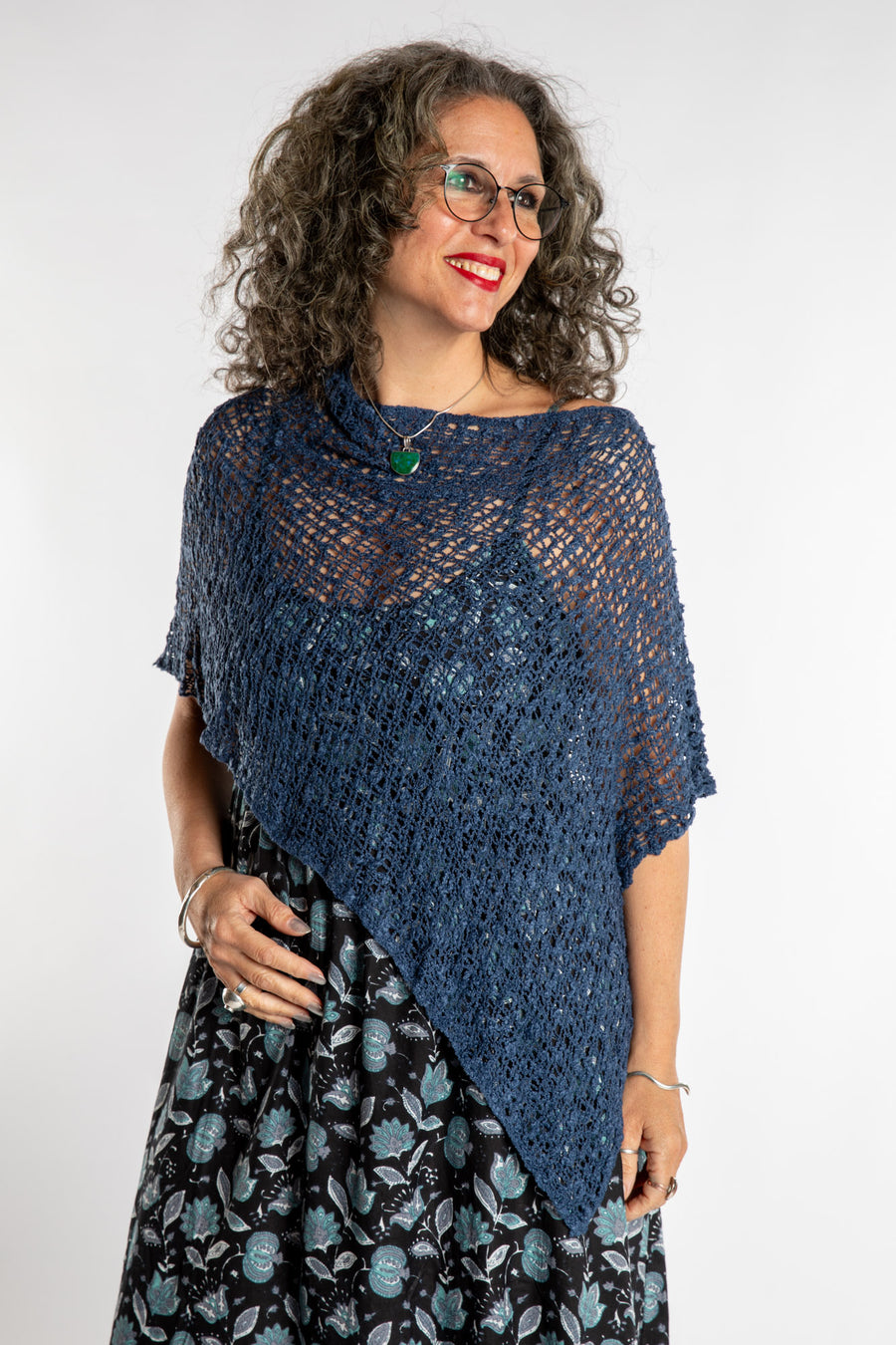 Susan is wear the Asymmetrical Loose Weave Poncho in Navy