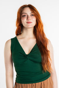 Honora is wearing the Twist Front Tank in Green in S/M