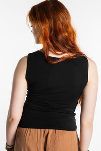 Honora is wearing the Twist Front Tank in Black in S/M