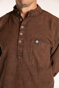Topher is wearing the Brown Baje Stone Wash Henley Shirt in a Large