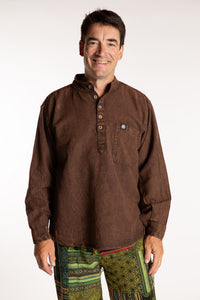 Topher is wearing the Brown Baje Stone Wash Henley Shirt in a Large