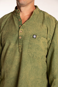Topher is wearing the Green Baje Stone Wash Henley Shirt in a Large