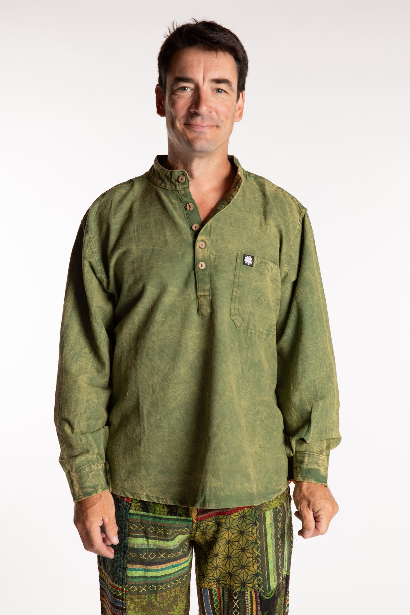 Topher is wearing the Green Baje Stone Wash Henley Shirt in a Large