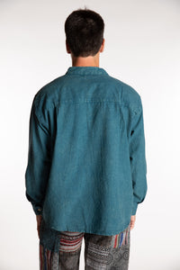 Topher is wearing the Teal Baje Stone Wash Henley Shirt in a Large