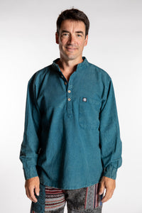 Topher is wearing the Teal Baje Stone Wash Henley Shirt in a Large