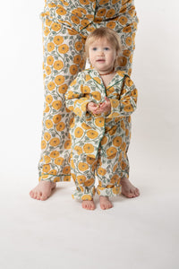 Daisy is wearing size 2/3 pajama set in dandelion
