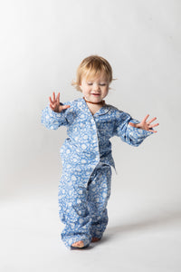 Daisy is wearing size 2/3 pajama set in blue poppies