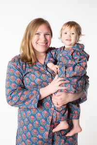 Olivia is wearing size XL pajama set in navy blooms
