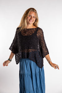 Sophie is wearing the Butterfly Lightweight Poncho in Black