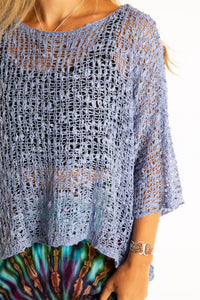 Sophie is wearing the Butterfly Lightweight Poncho in Blue