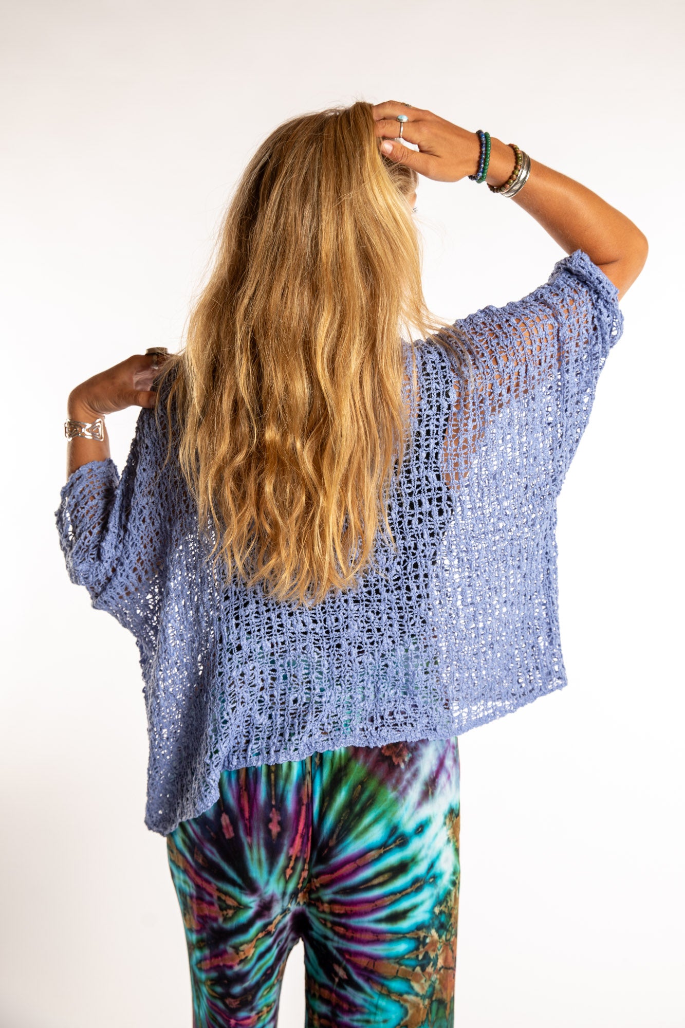 Sophie is wearing the Butterfly Lightweight Poncho in Blue