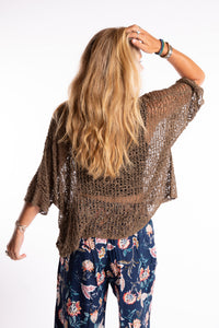 Sophie is wearing the Butterfly Lightweight Poncho in Brown
