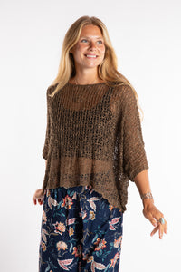 Sophie is wearing the Butterfly Lightweight Poncho in Brown