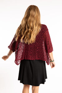 Sophie is wearing the Butterfly Lightweight Poncho in Maroon