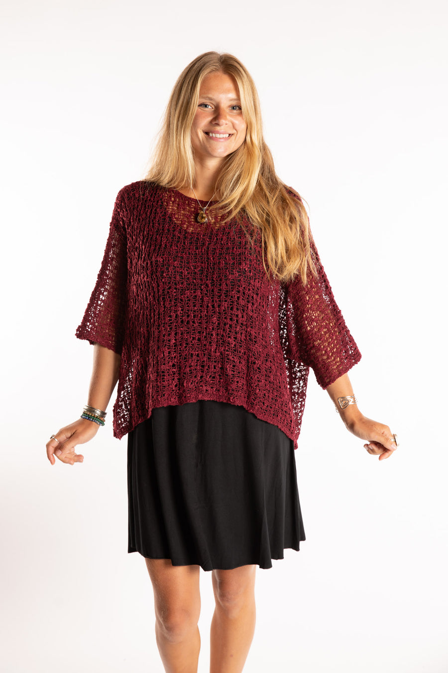 Sophie is wearing the Butterfly Lightweight Poncho in Maroon