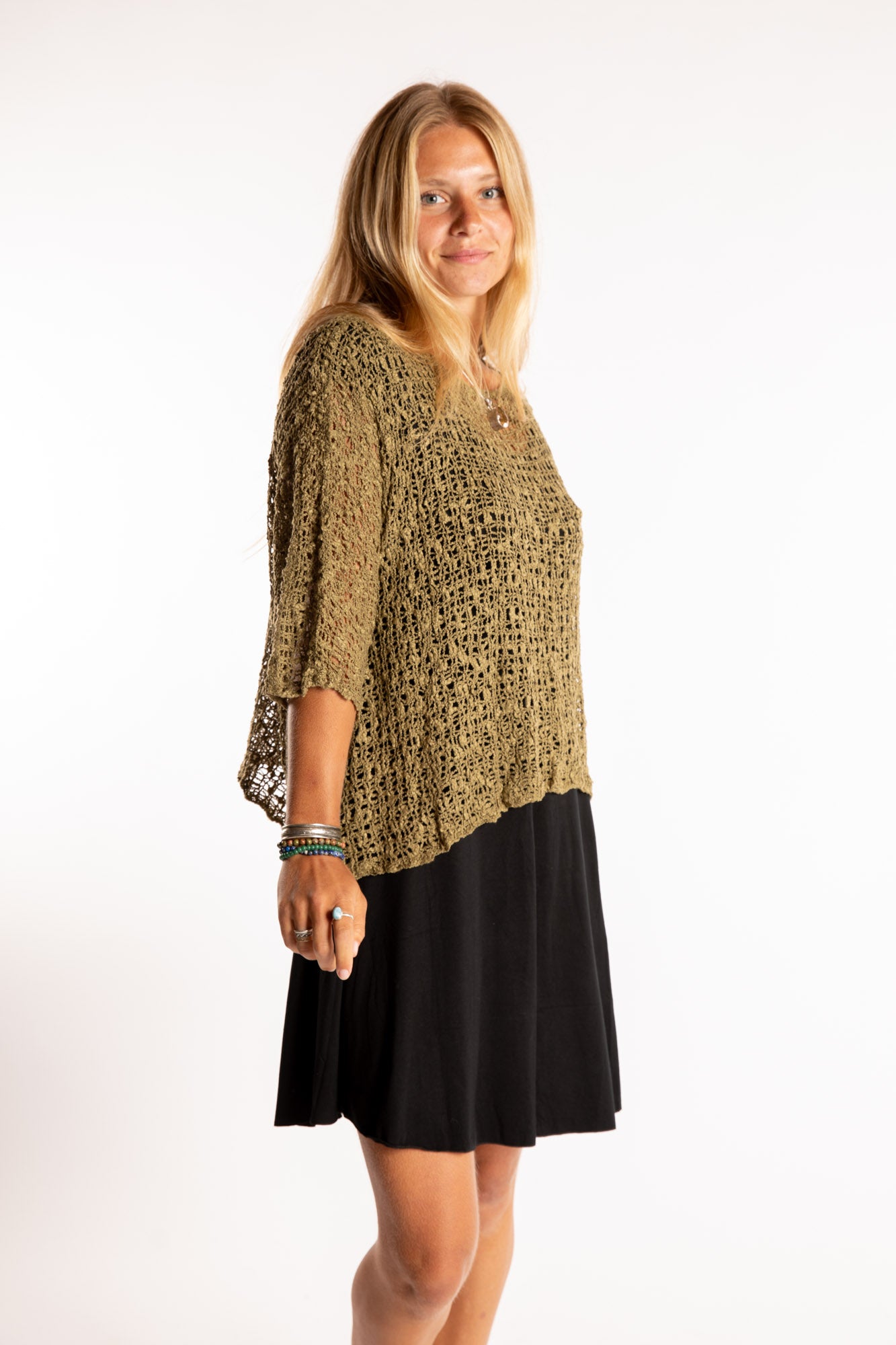Sophie is wearing the Butterfly Lightweight Poncho in Olive
