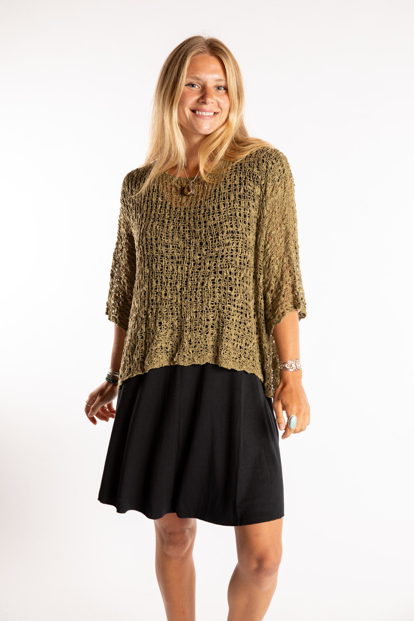 Sophie is wearing the Butterfly Lightweight Poncho in Olive