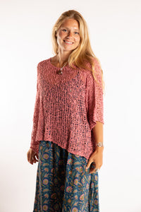 Sophie is wearing the Butterfly Lightweight Poncho in Pink