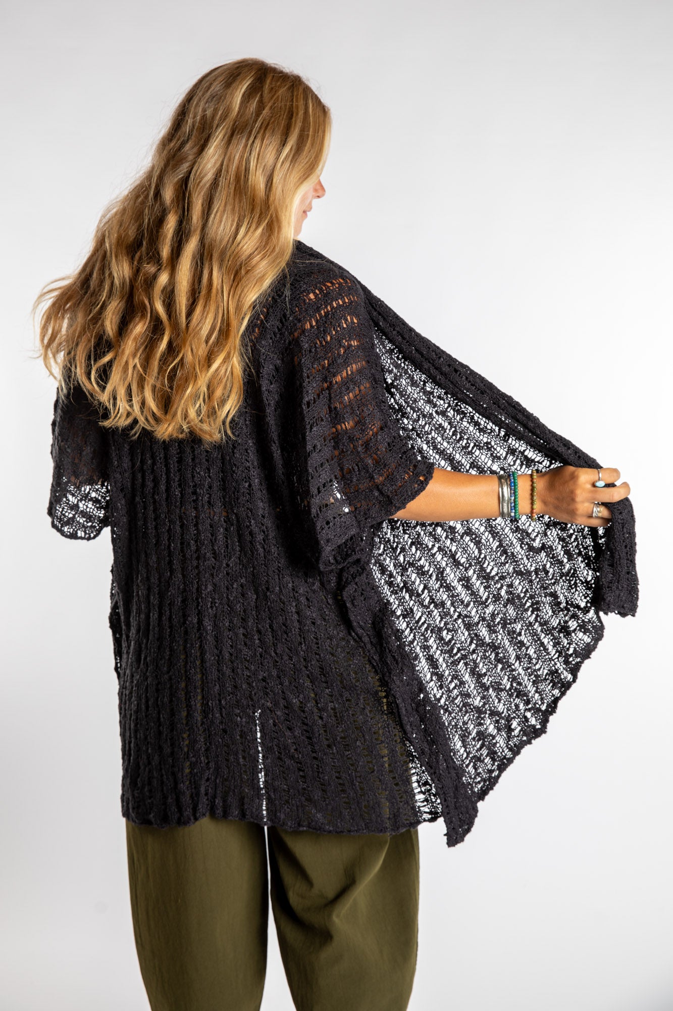Sophie is wear the Cascade Loose Weave Cardigan in Black