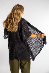 Sophie is wear the Cascade Loose Weave Cardigan in Black