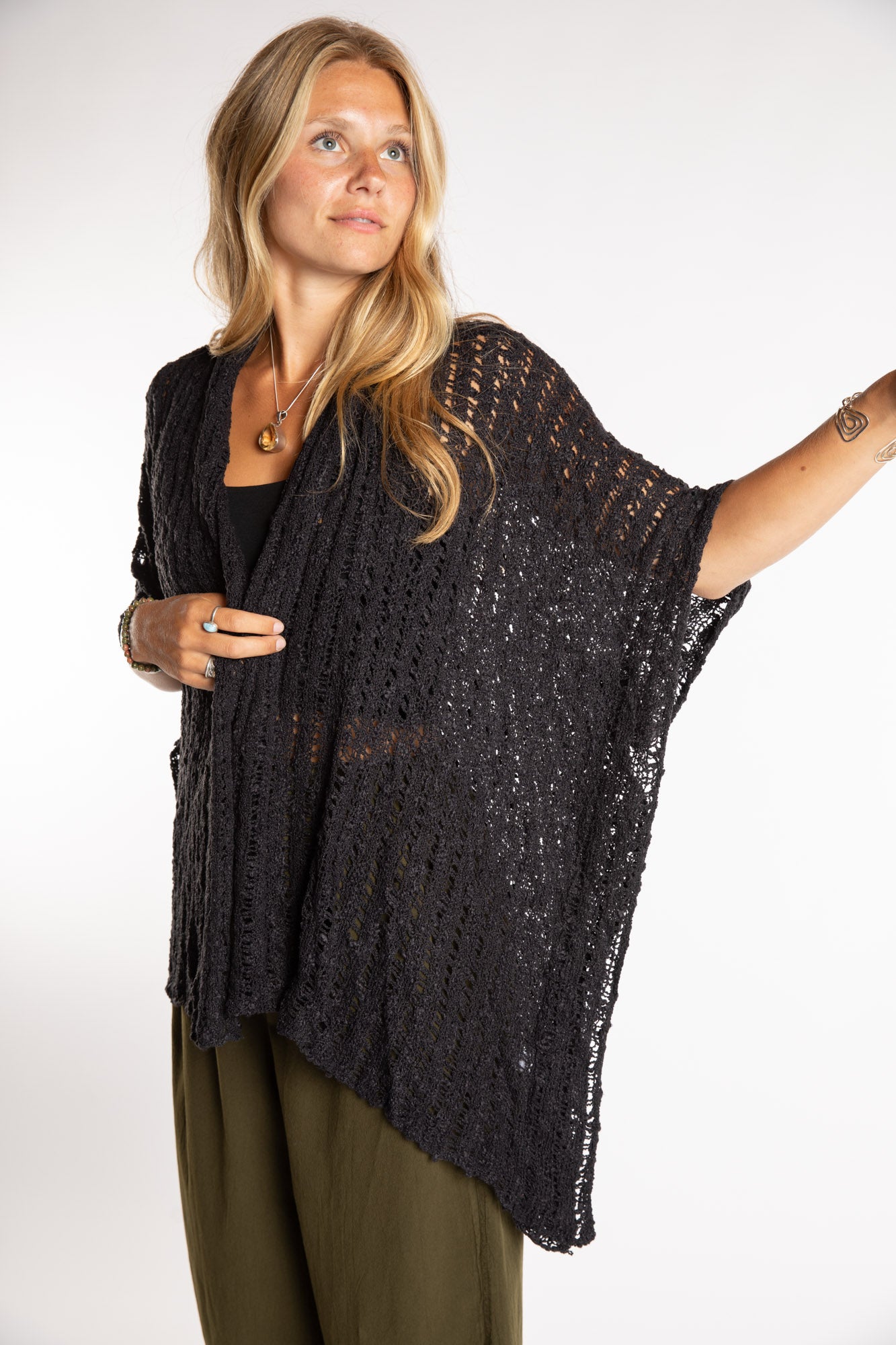 Sophie is wear the Cascade Loose Weave Cardigan in Black