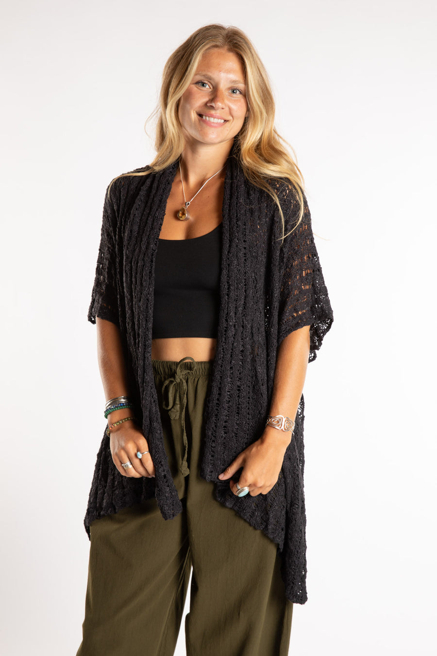 Sophie is wear the Cascade Loose Weave Cardigan in Black